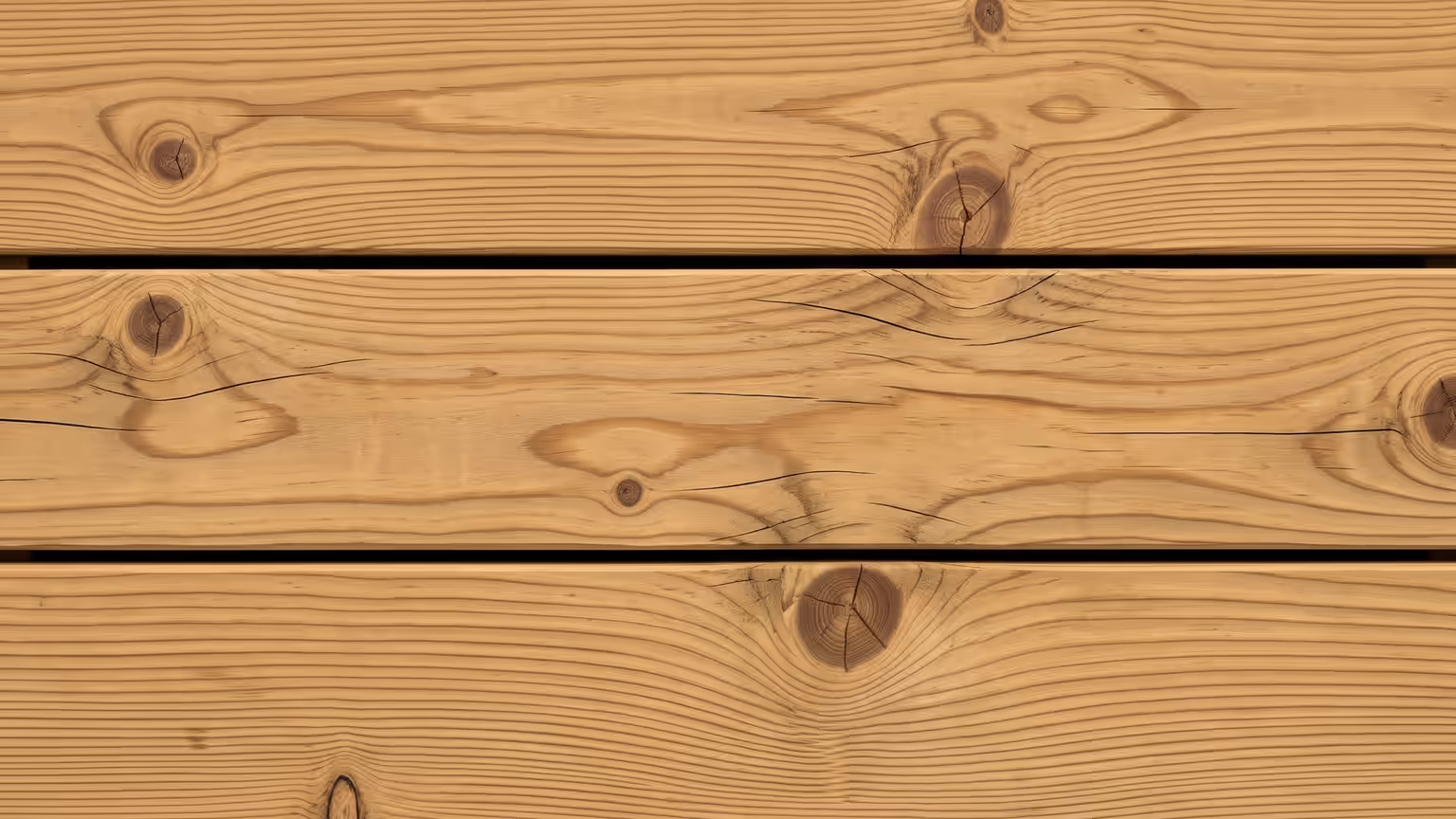Pale golden pressure-treated pine deck boards with open knots and fine surface checking